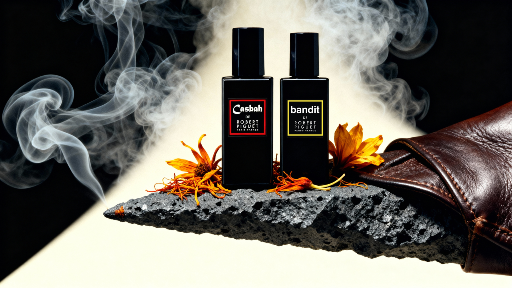 Casbah and Bandit perfume bottles surrounded by smoke, saffron flowers, and leather
